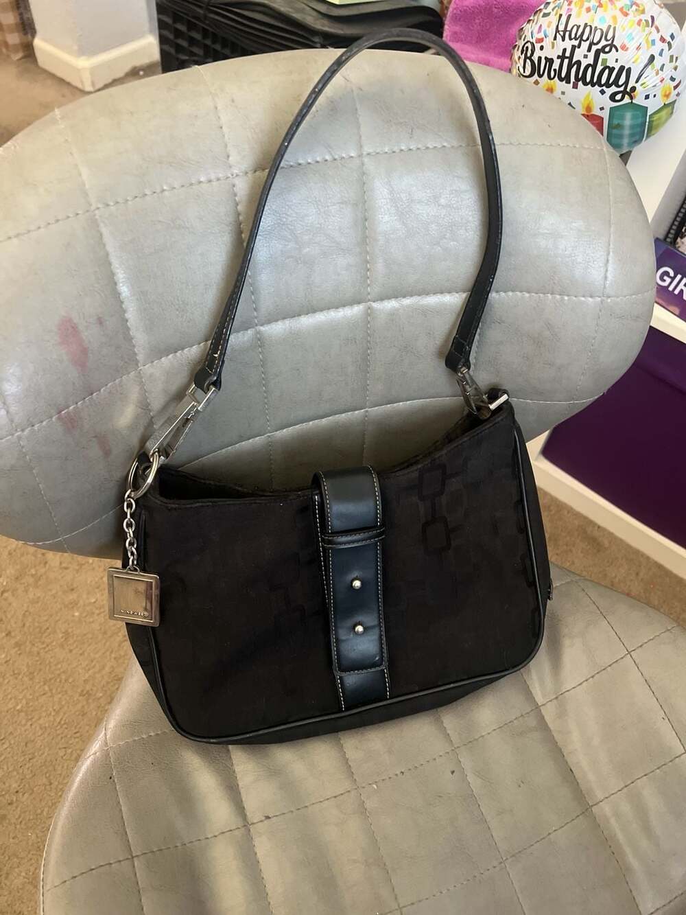black nine west shoulder bag with silver detailing